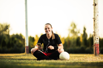 Happy female soccer player resting © bokan