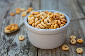 Healthy breakfast cereal rings in bowl. Good morning. A healthy breakfast. Dry muesli.