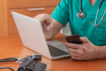 surgeon looking scheduling an appointment for a patient who require surgery in a mobile phone. Image with copy space - Powered by Adobe