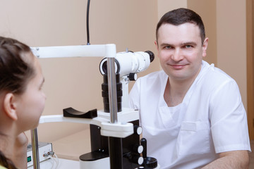 Doctor examining little girl.