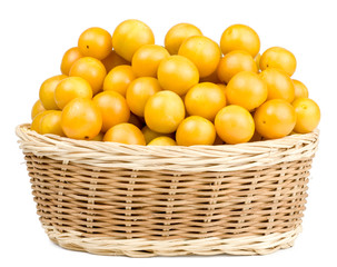 Cherry plums in basket isolated on white