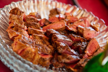 Beef steak cooking. Rib eye steak. Raw meat. Juicy marbled meat on BBQ grill. Medium rare meat roasting