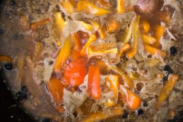 Cook zirvak broth for cooking pilaf meat with rice on fire in the cauldron. Recipe