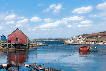 Fototapeta na wymiar nova scotia fishing shed with boat in harbor
