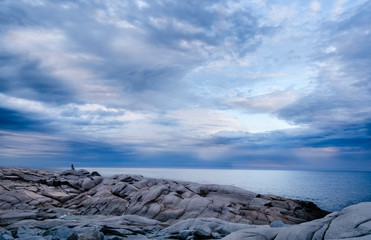 nova scotia dramatic sky and clouds with father and son 