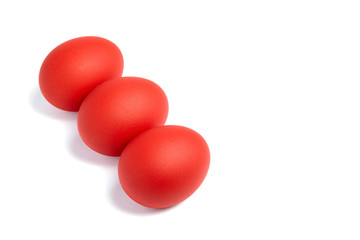 Three red Easter eggs isolated on white background. Traditional symbol of Christian holiday