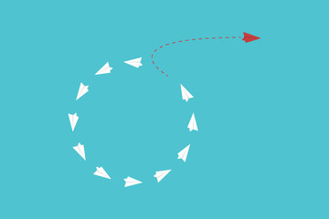 Think differently concept. Be different. Red airplane changing direction. New idea, change, trend, courage, creative solution, innovation and unique way concept. 