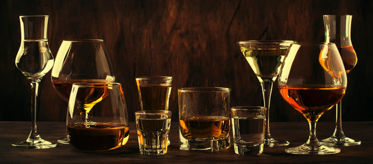 Strong Spirits Set. Hard alcoholic drinks in glasses in assortment: vodka, cognac, tequila, brandy...