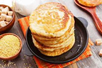 Millet pancakes in a frying pan