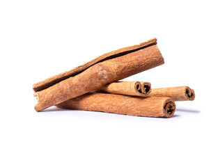 Dried cinnamon sticks close-up, isolated on a white background
