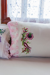 Traditional Turkish handmade colorful natural fabric pillows. Decorative floral embroidery pattern, ornament for clothing decor. Bohemian handmade style decoration design. Turkish butha.