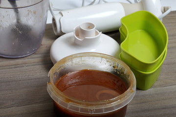 Honey in the container. Ingredients and tools for making halva.