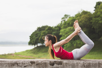 Fototapeta na wymiar Asian woman doing yoga fitness exercise