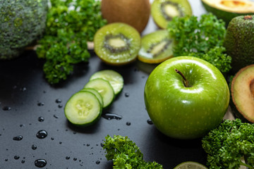 Healthy Foods. Organic and Fresh green vegetable for detox, diet and weight loss on the old wooden. Healthy Concept.