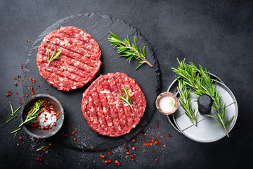 Fresh raw minced beef steak burgers with spices