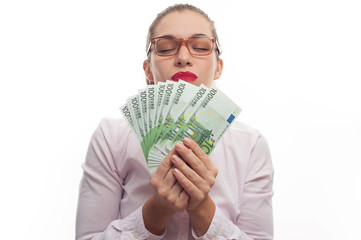 Portrait of young woman holding 100 euro cash fan