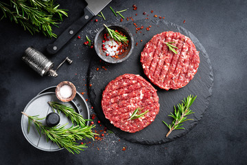 Fresh raw minced beef steak burgers with spices