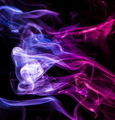 Fototapeta premium Colored smoke on black background