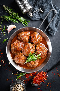 Beef meatballs with spices in tomato sauce