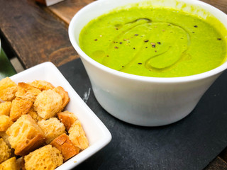 spinach cream soup & croutons close up