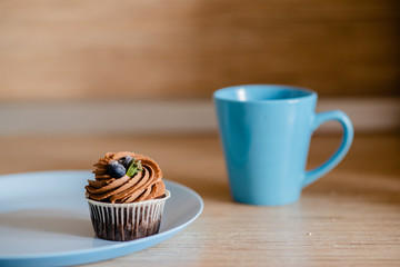 decorated  tasty Cupcake with slice of Strawberry and Chocolate on the table. Horizontal view several objects