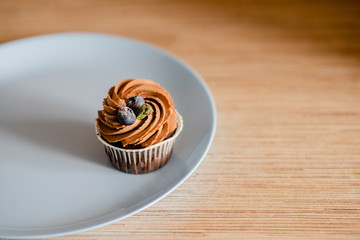 decorated  tasty Cupcake with slice of Strawberry and Chocolate on the table. Horizontal view several objects
