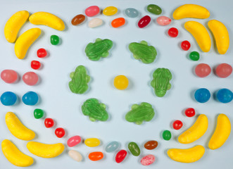 Colorful sweets and fruit jelly on a blue background