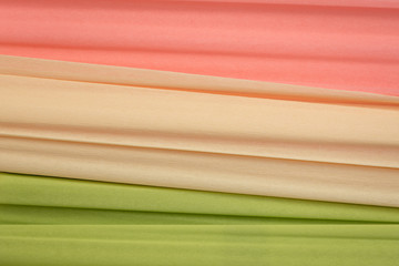 lime green, cream and salmon crepe paper background