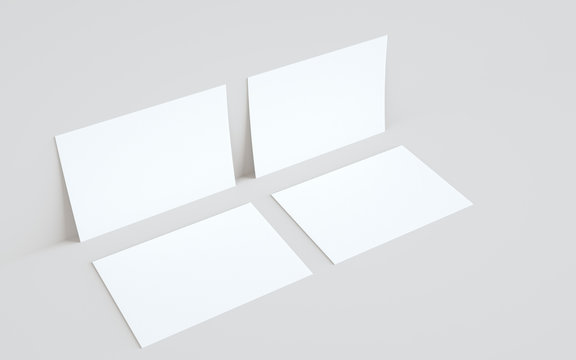 A5 Flyer / Brochure Mock-Up - Two Flyers Against Wall Background. 3D Illustration