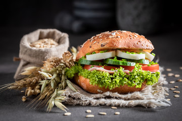 Tasty sandwich with lettuce, egg and tomato