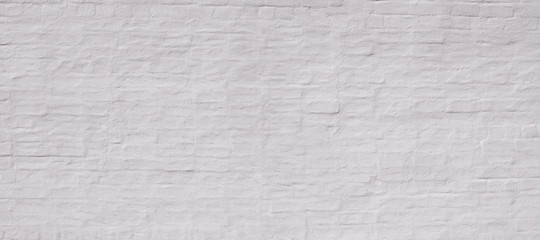 White painted plastered vintage old brick wall. Background  for text or image. 