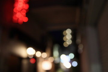 Bokeh of a small alley's night lights