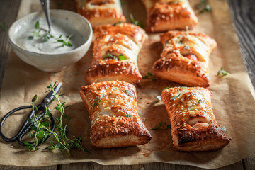 Hot sausage in puff pastry as a snack for breakfast