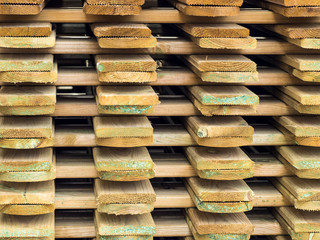Wooden planks sorted in a pile