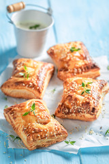 Tasty sausage in puff pastry with thyme and sesame seeds