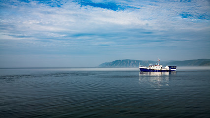 Fototapeta premium Ship on Misty Lake Baikal in Siberia