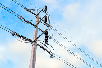 High voltage electricity pole on bright sky clouds background, Electricity pole against blue sky...