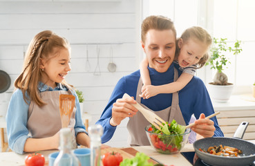 Happy family in the kitchen.