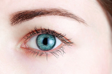 Beautiful female blue eye close-up, vision correction concept