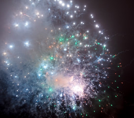 Beautiful sparks from fireworks in the sky at night