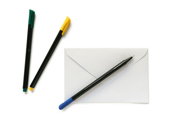 White letter envelope and pens