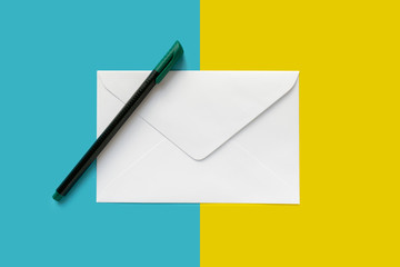 White letter envelope and a pen