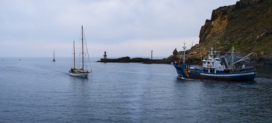 motorboat and sailboat, fishing boat on the coast of the Cantabrian Sea, Basque Country © poliki