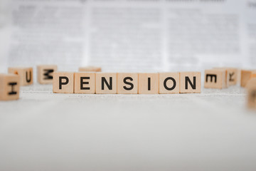 Pension Word Written In Wooden Cube - Newspaper 