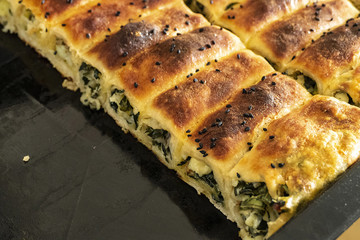 homemade pastries, spinach pie, sesame buns and bagels, Turkish style dough food,