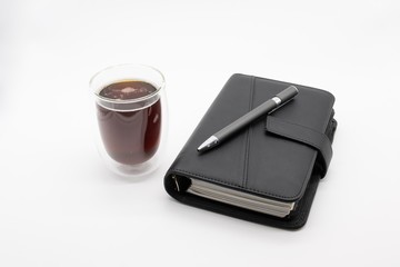 filofax and coffee, isolated on white background