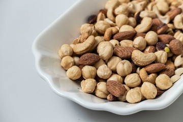 a plate full of nuts, cashews, almonds dry, close-up