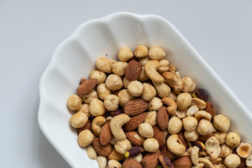 a plate full of nuts, cashews, almonds dry, close-up