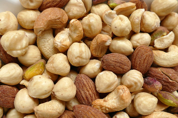 nuts, peeled hazelnuts, cashews and almonds, stand together,
