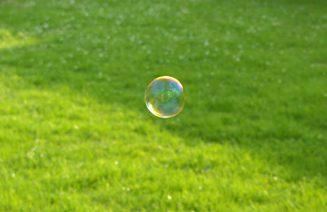 Soap bubbles,  green grass background